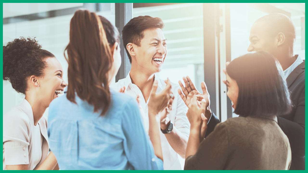 People laughing and discussing wearing business clothes